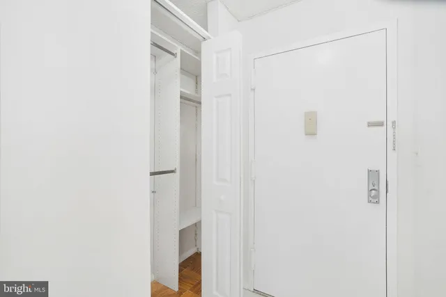 a bathroom with a shower and a door