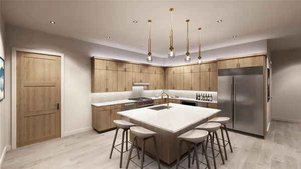 a kitchen with refrigerator and chairs