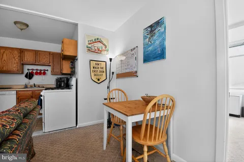 a dining room that has a table and a chair in it