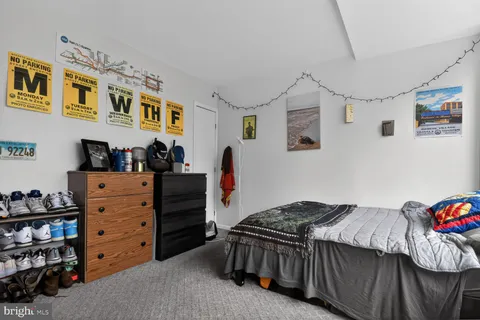 a bedroom with a bed and a closet