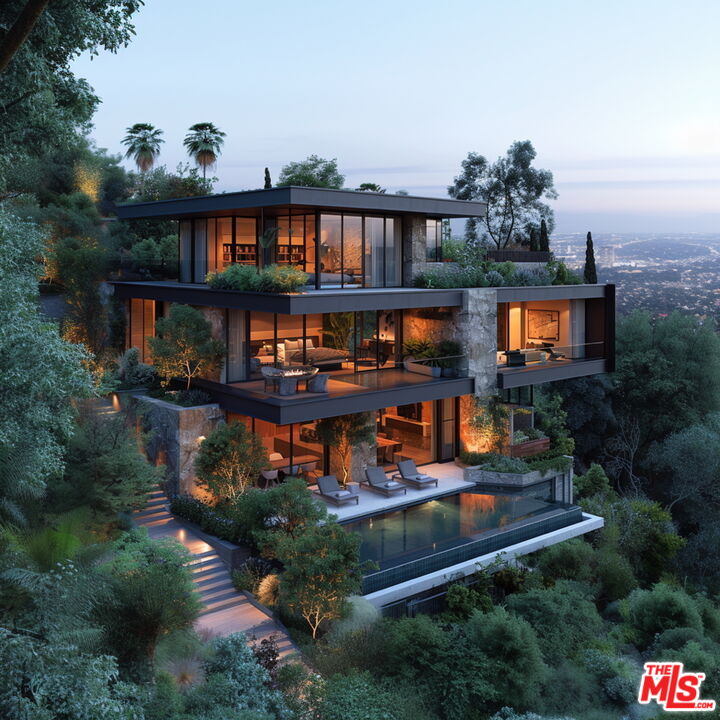 389 Upper Mesa Road Santa Monica, CA 90402 - Photo 2 of 10 an aerial view of a house with swimming pool outdoor seating and yard