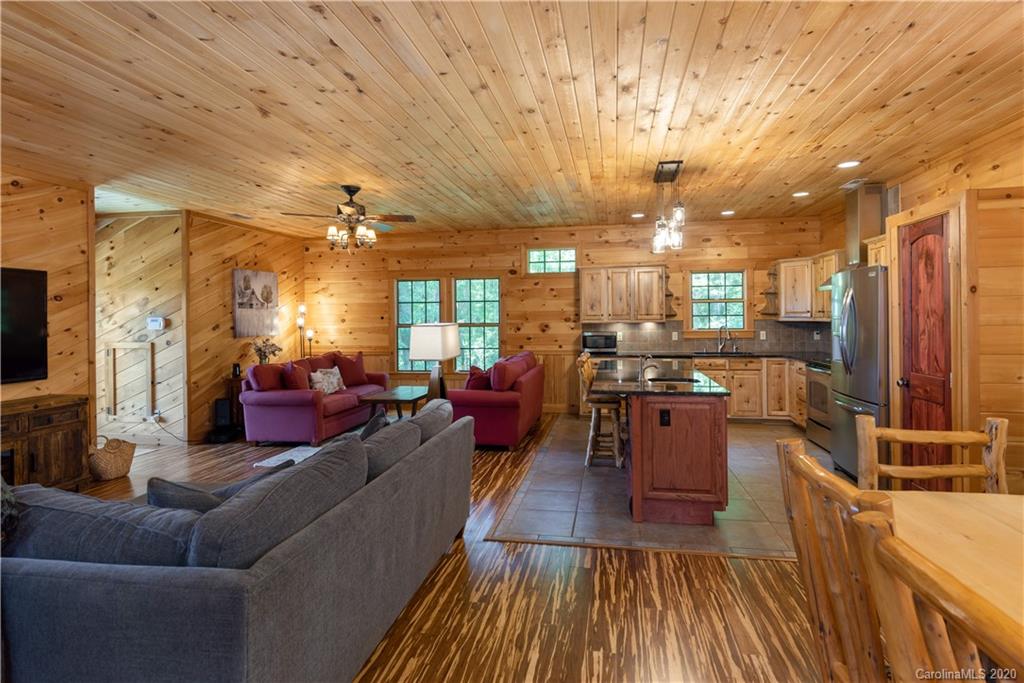211 Lagrange Road, Unit TRACK 2 Waynesville, NC 28786 - Photo 15 of 48 a living room with furniture kitchen view and a wooden floor