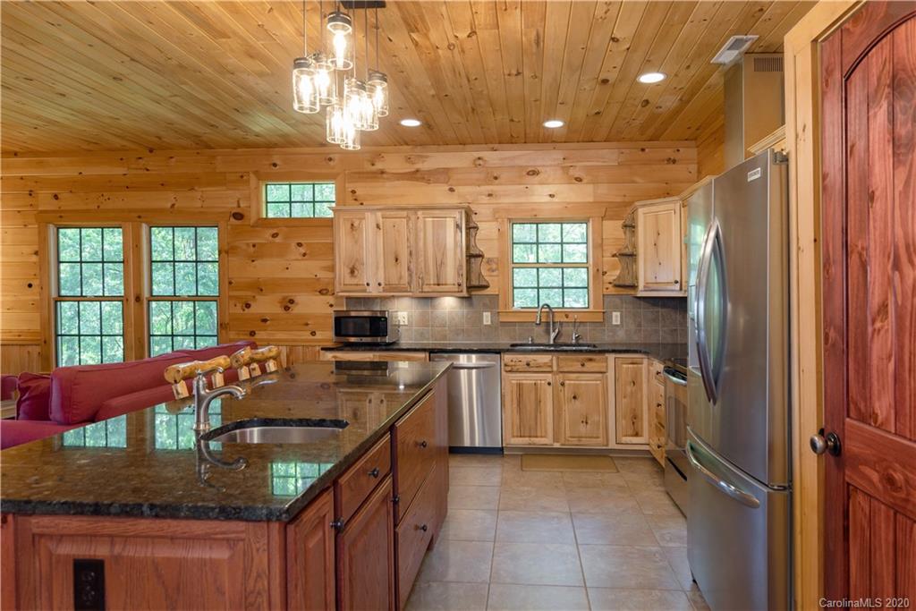 211 Lagrange Road, Unit TRACK 2 Waynesville, NC 28786 - Photo 18 of 48 a kitchen with stainless steel appliances granite countertop a sink stove and refrigerator