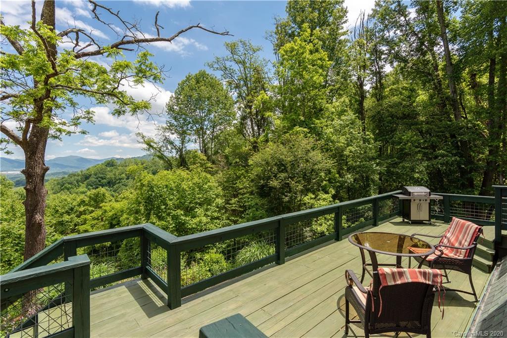211 Lagrange Road, Unit TRACK 2 Waynesville, NC 28786 - Photo 21 of 48 a view of a balcony with wooden floor and outdoor seating