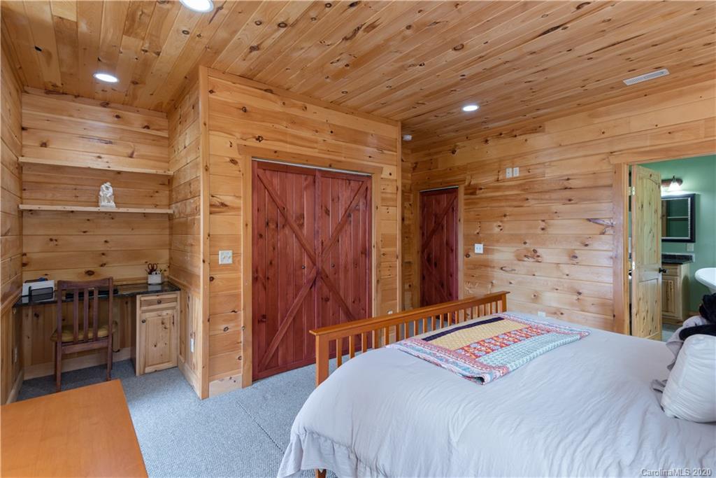 211 Lagrange Road, Unit TRACK 2 Waynesville, NC 28786 - Photo 23 of 48 a bedroom with a bed and a walk in closet