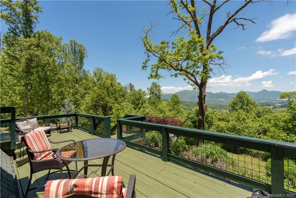 211 Lagrange Road, Unit TRACK 2 Waynesville, NC 28786 - Photo 5 of 48 a view of a balcony with chairs