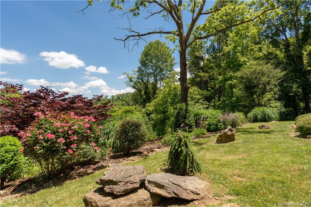 211 Lagrange Road, Unit TRACK 2 Waynesville, NC 28786 - Photo 42 of 48 a backyard of a house with lots of green space