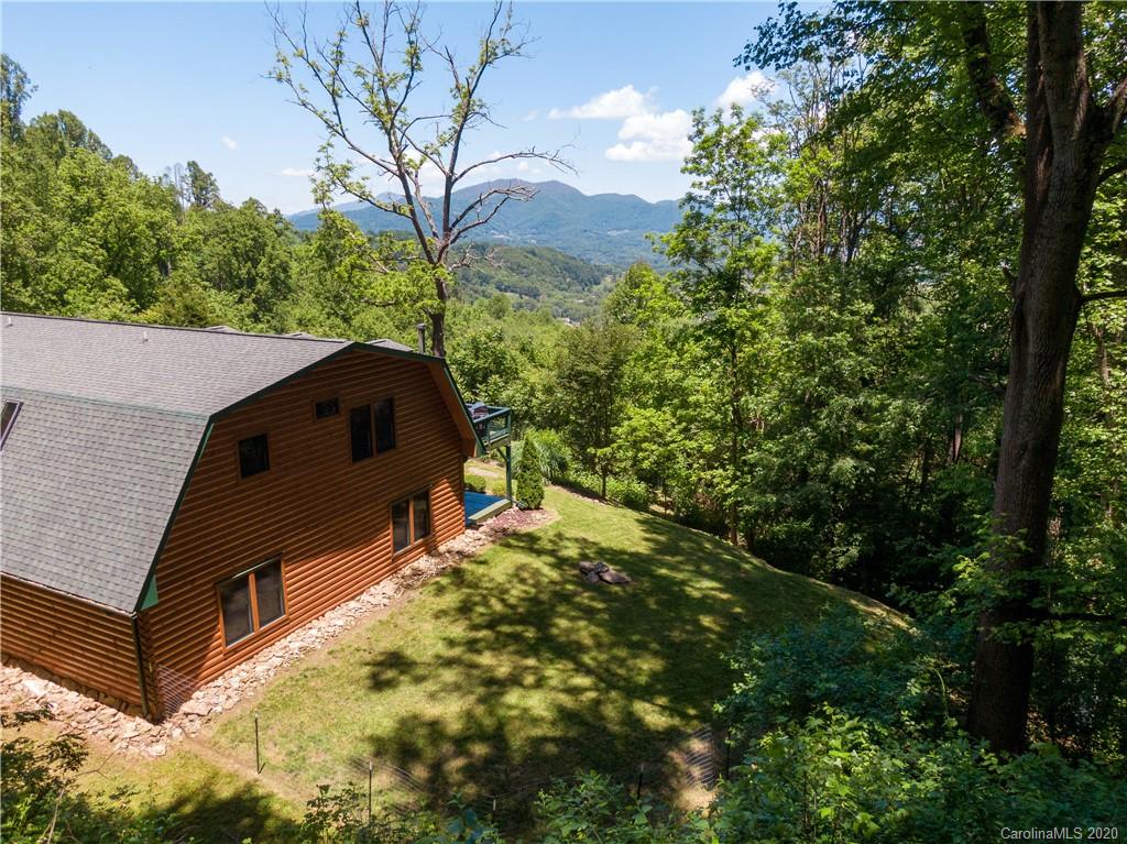 211 Lagrange Road, Unit TRACK 2 Waynesville, NC 28786 - Photo 46 of 48 a backyard of a house with lots of green space