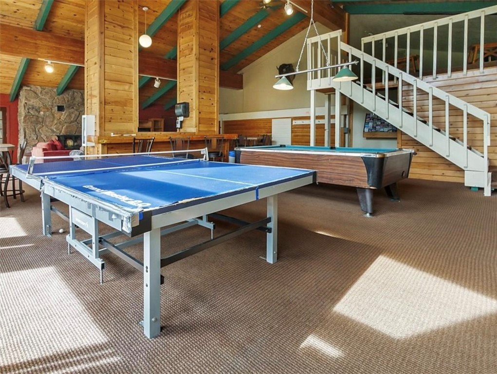 9876 Ryan Gulch Road, Unit 106 Silverthorne, CO 80498 - Photo 23 of 27 a balcony with table and chairs