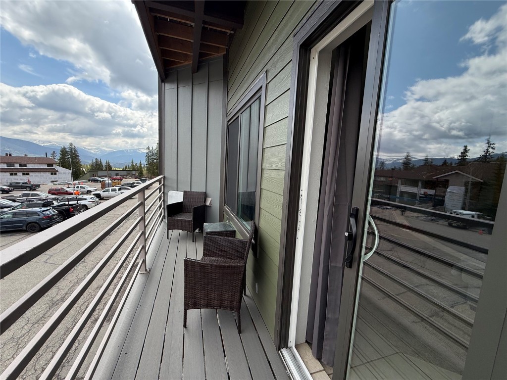 9876 Ryan Gulch Road, Unit 106 Silverthorne, CO 80498 - Photo 10 of 27 a balcony with a bench