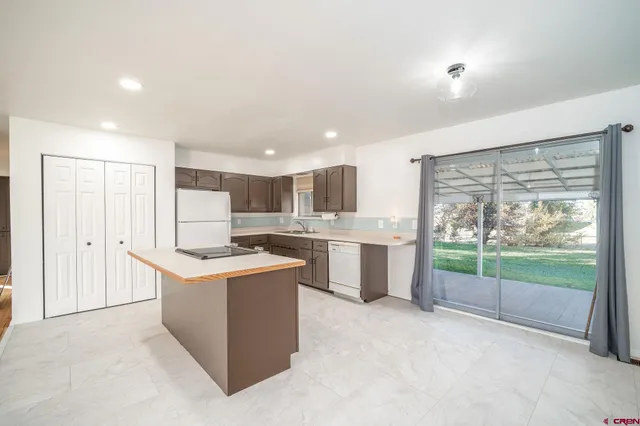 a kitchen with a sink and refrigerator