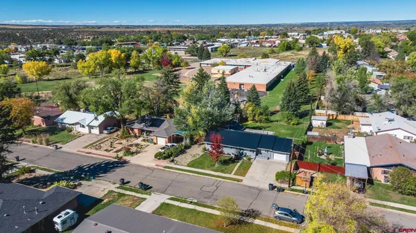 an aerial view of residential house with outdoor space and street view
