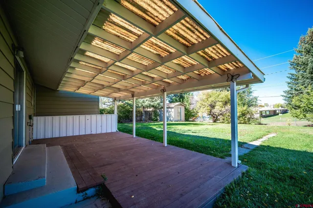 a view of backyard with green space