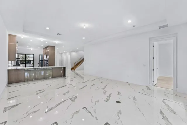 a view of kitchen and hall with a sink