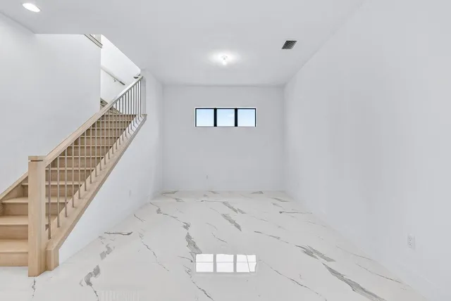 a view of a hallway with staircase