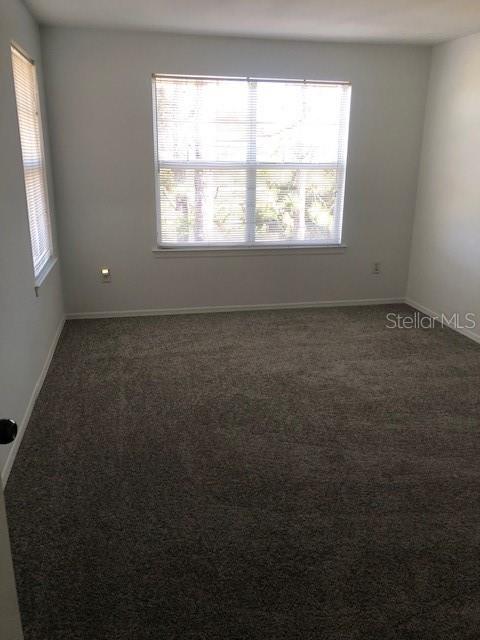 413 Summit Ridge Place, Unit 305 Longwood, FL 32779 - Photo 6 of 11 an empty room with a window