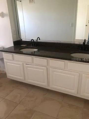 a close view of a stove a microwave and cabinets