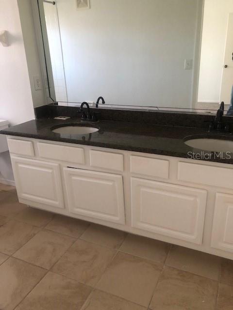 413 Summit Ridge Place, Unit 305 Longwood, FL 32779 - Photo 7 of 11 a close view of a stove a microwave and cabinets