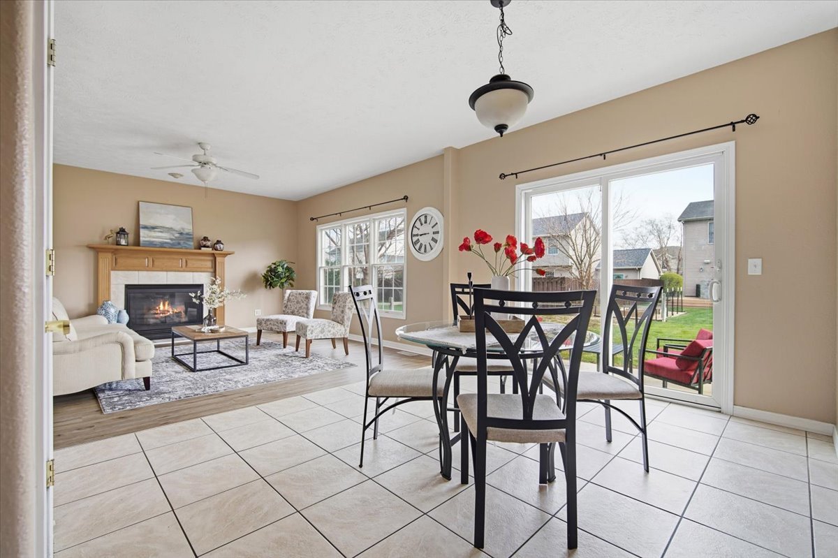 3255 Fire Fly Court Normal, IL 61761 - Photo 8 of 25 a view of a dining room with furniture window and outside view