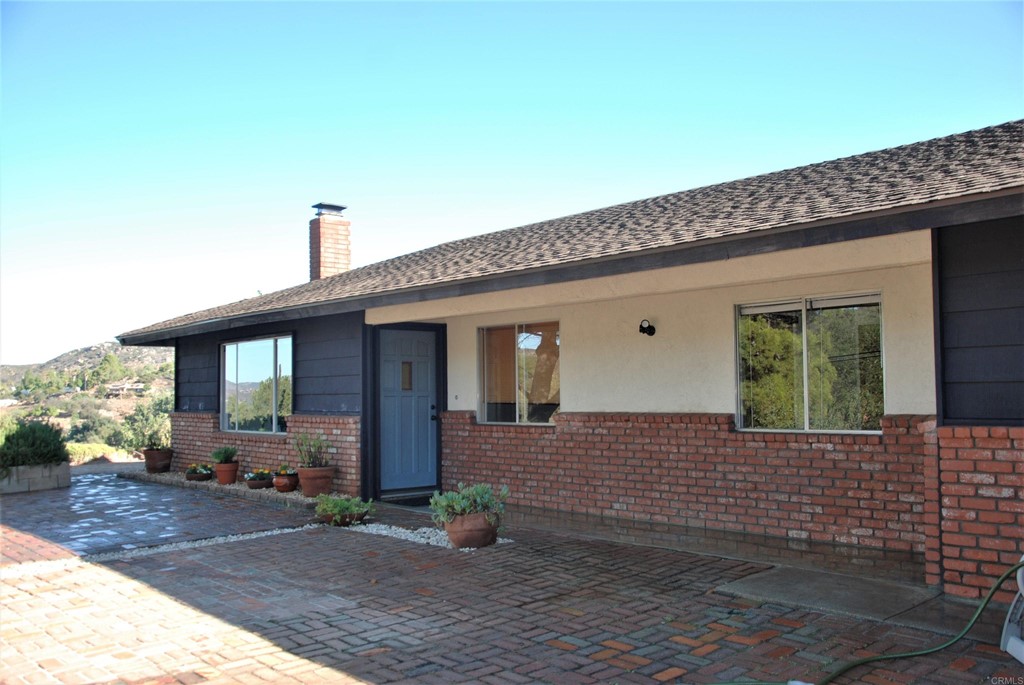 790 South Grade Road Alpine, CA 91901 - Photo 1 of 1 a front view of a house with garden