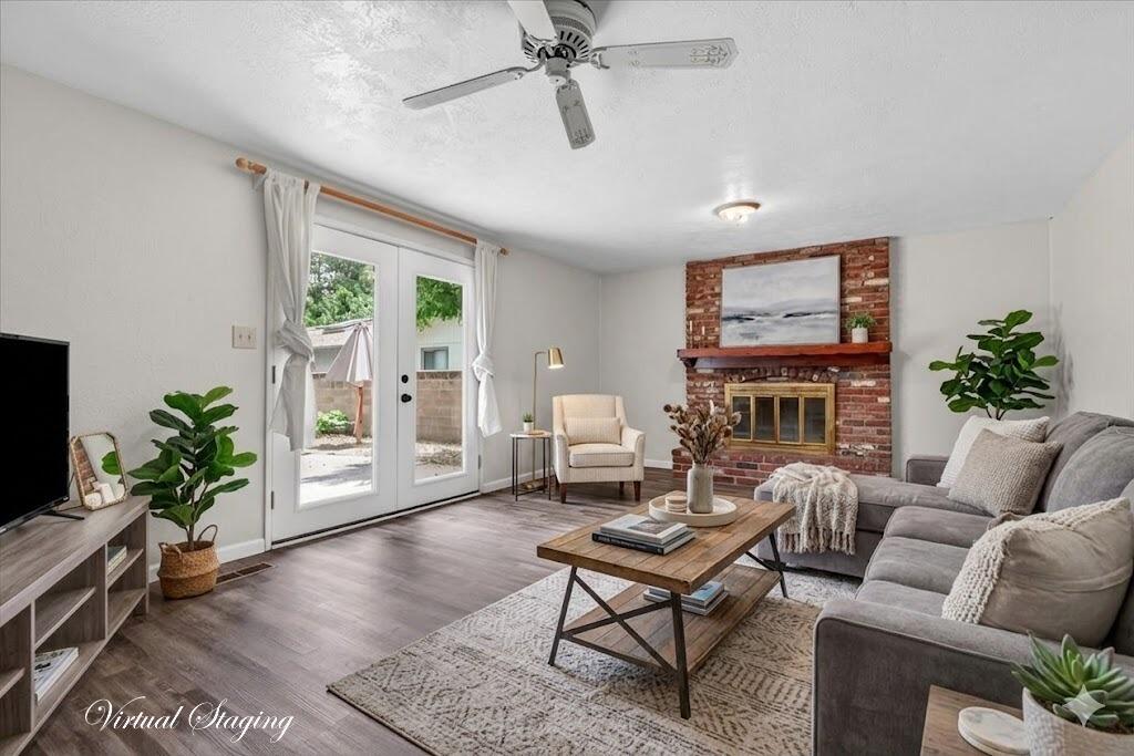 415 Sutter Avenue Medford, OR 97504 - Photo 11 of 28 a living room with furniture a fireplace and a potted plant