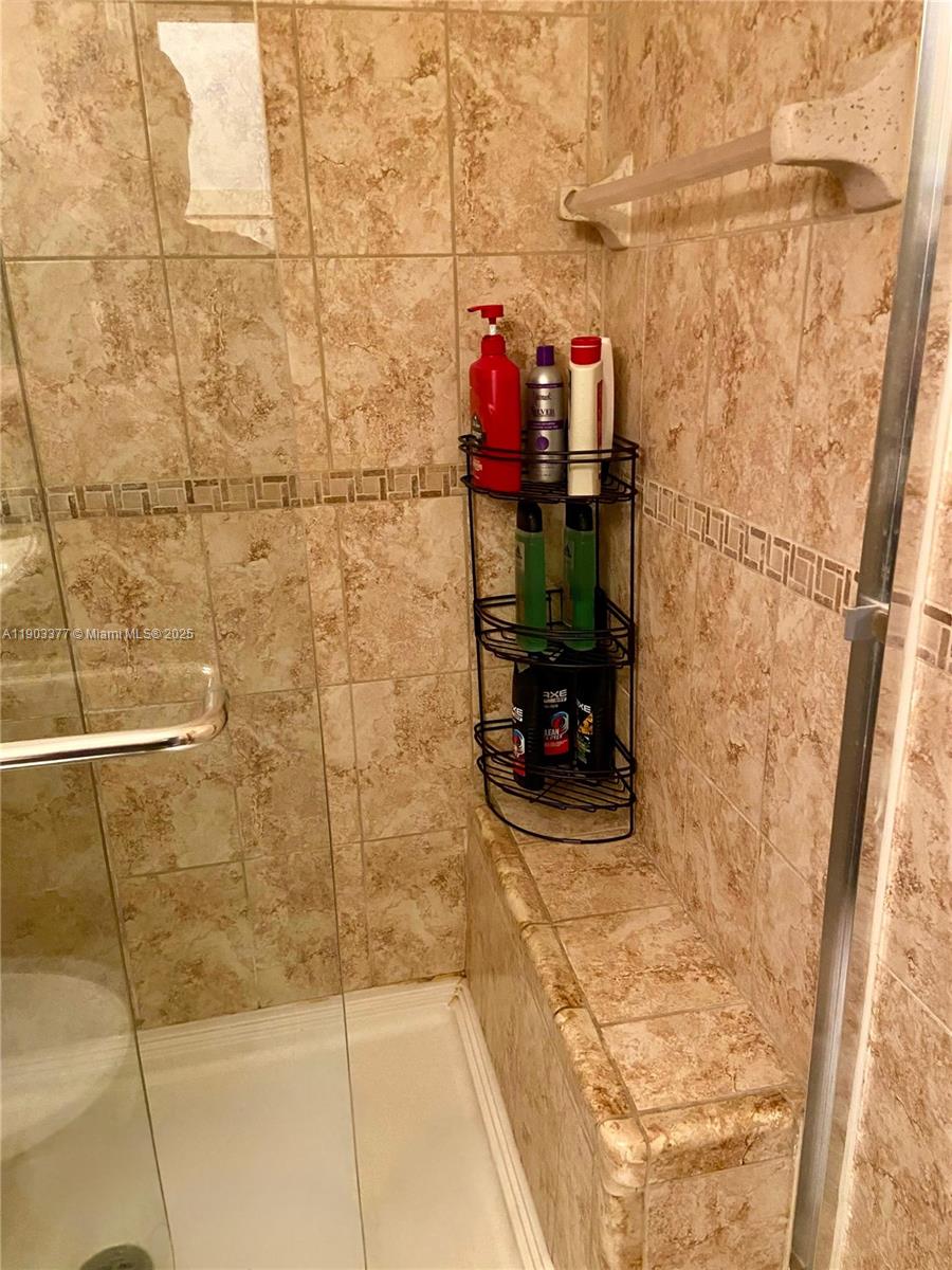 15610 Northeast 6th Avenue, Unit 32D Miami, FL 33162 - Photo 15 of 15 a bathroom with a shower