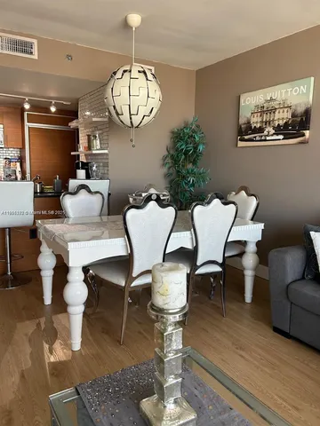 a view of a living room and hardwood floor