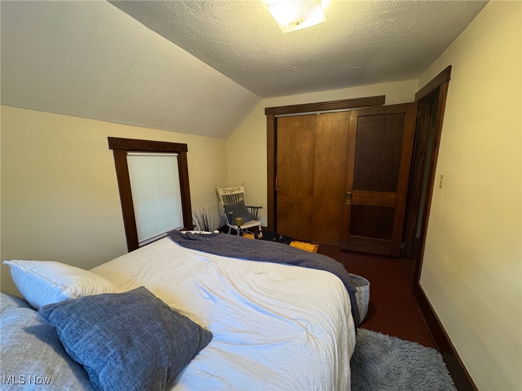 5322 Lockwood Road Madison, OH 44057 - Photo 17 of 30 Bedroom featuring lofted ceiling, and a closet
