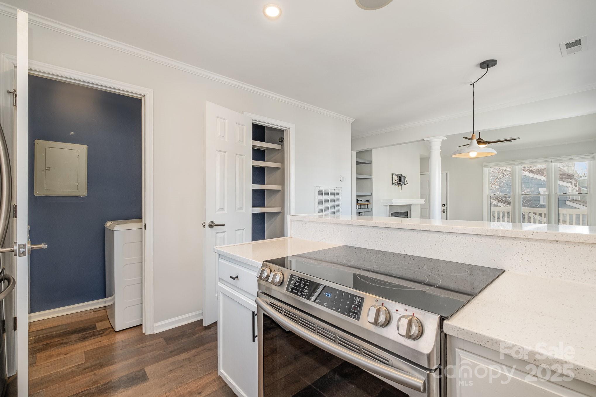 433 West 8th Street Charlotte, NC 28202 - Photo 13 of 25 a kitchen with a stove and a wooden floor