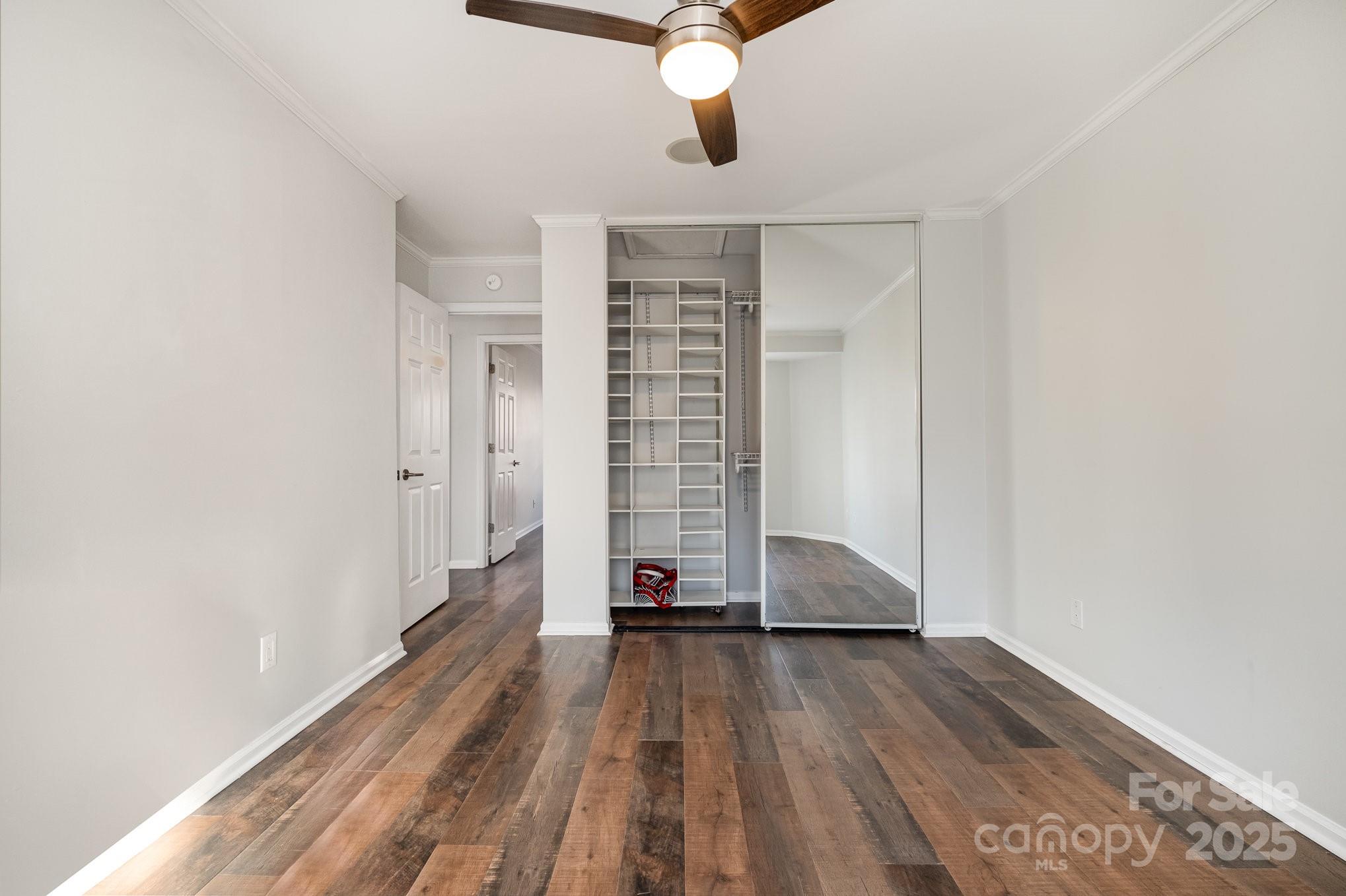 433 West 8th Street Charlotte, NC 28202 - Photo 15 of 25 a view of a room with wooden floor and ceiling fan