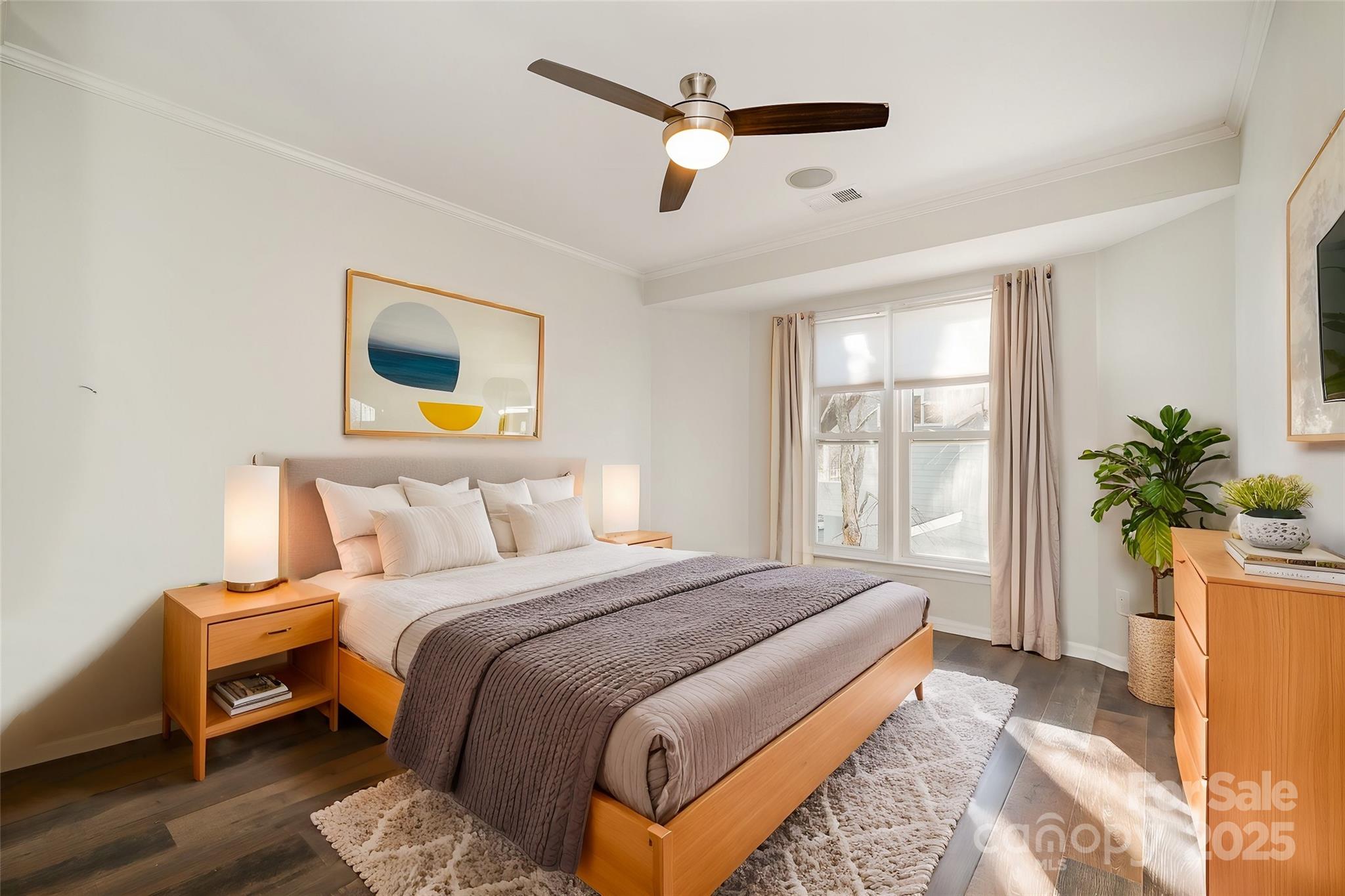 433 West 8th Street Charlotte, NC 28202 - Photo 16 of 25 a bedroom with a bed a chandelier and a window