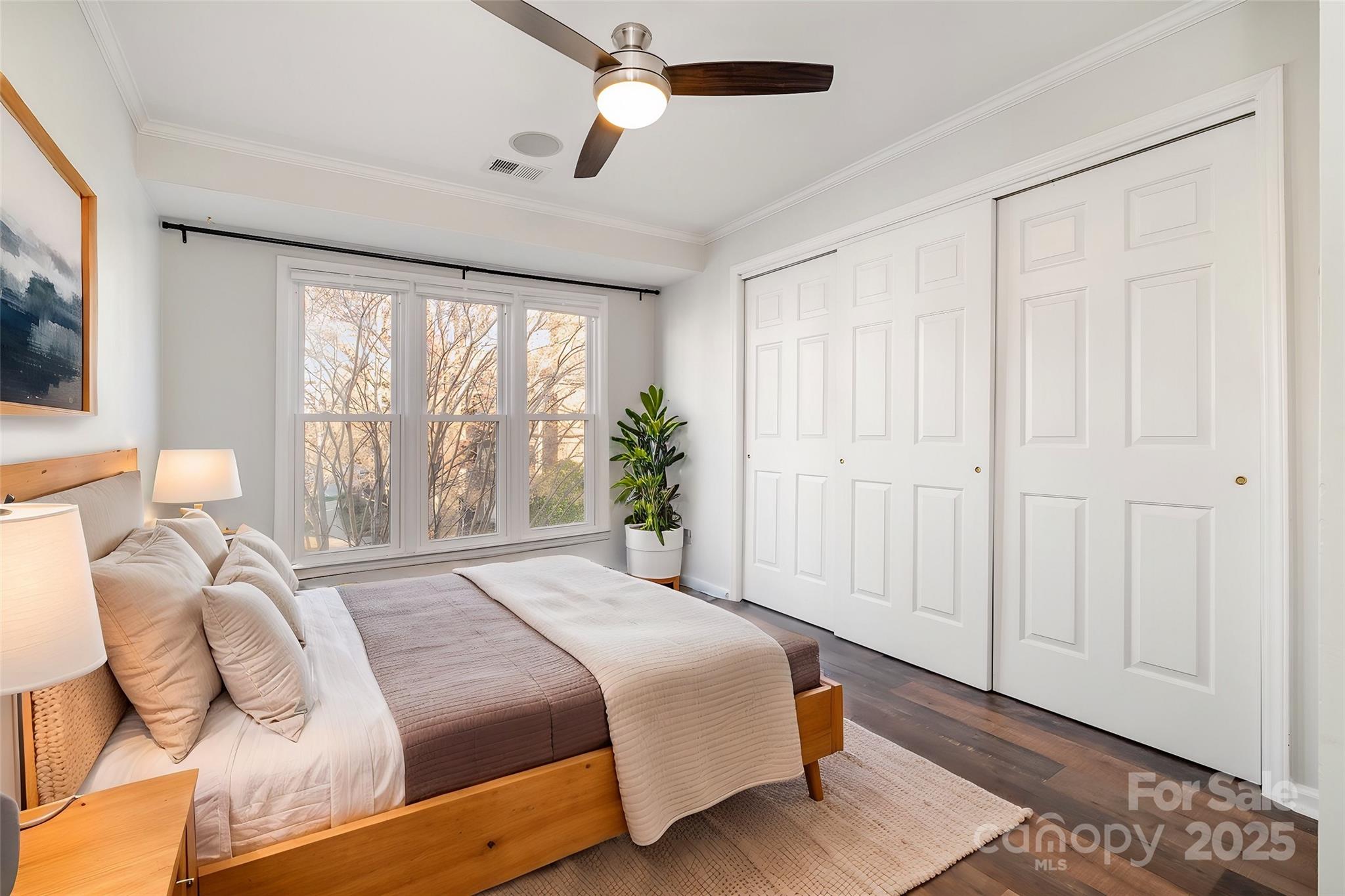 433 West 8th Street Charlotte, NC 28202 - Photo 19 of 25 a bedroom with a bed and a window