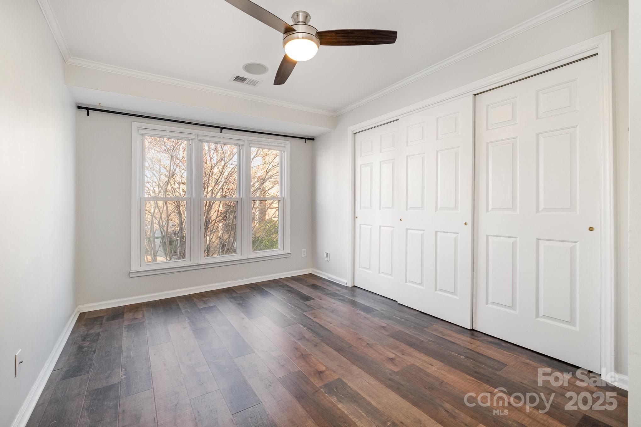 433 West 8th Street Charlotte, NC 28202 - Photo 20 of 25 wooden floor in an empty room with a window