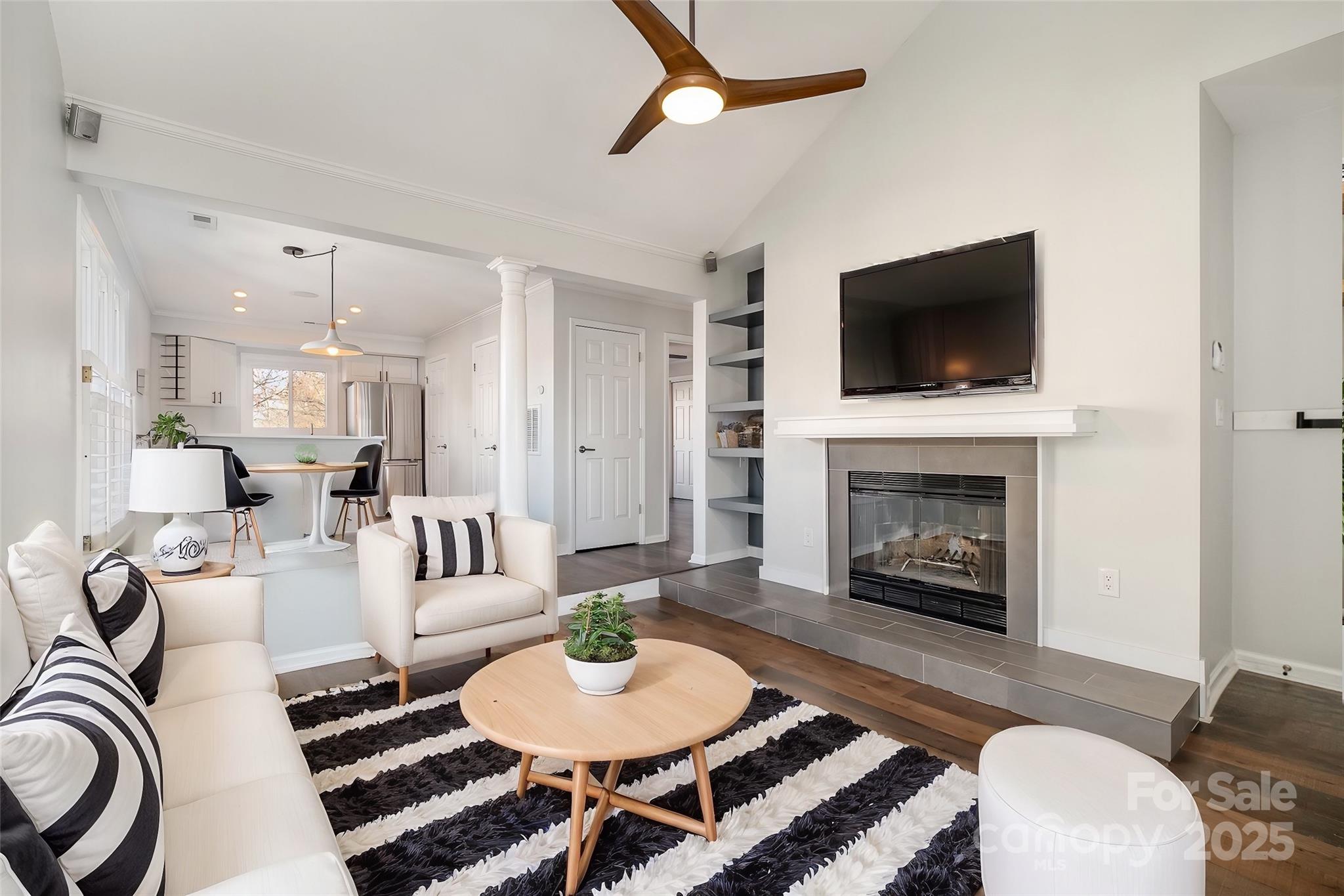 433 West 8th Street Charlotte, NC 28202 - Photo 5 of 25 a living room with furniture and a fireplace