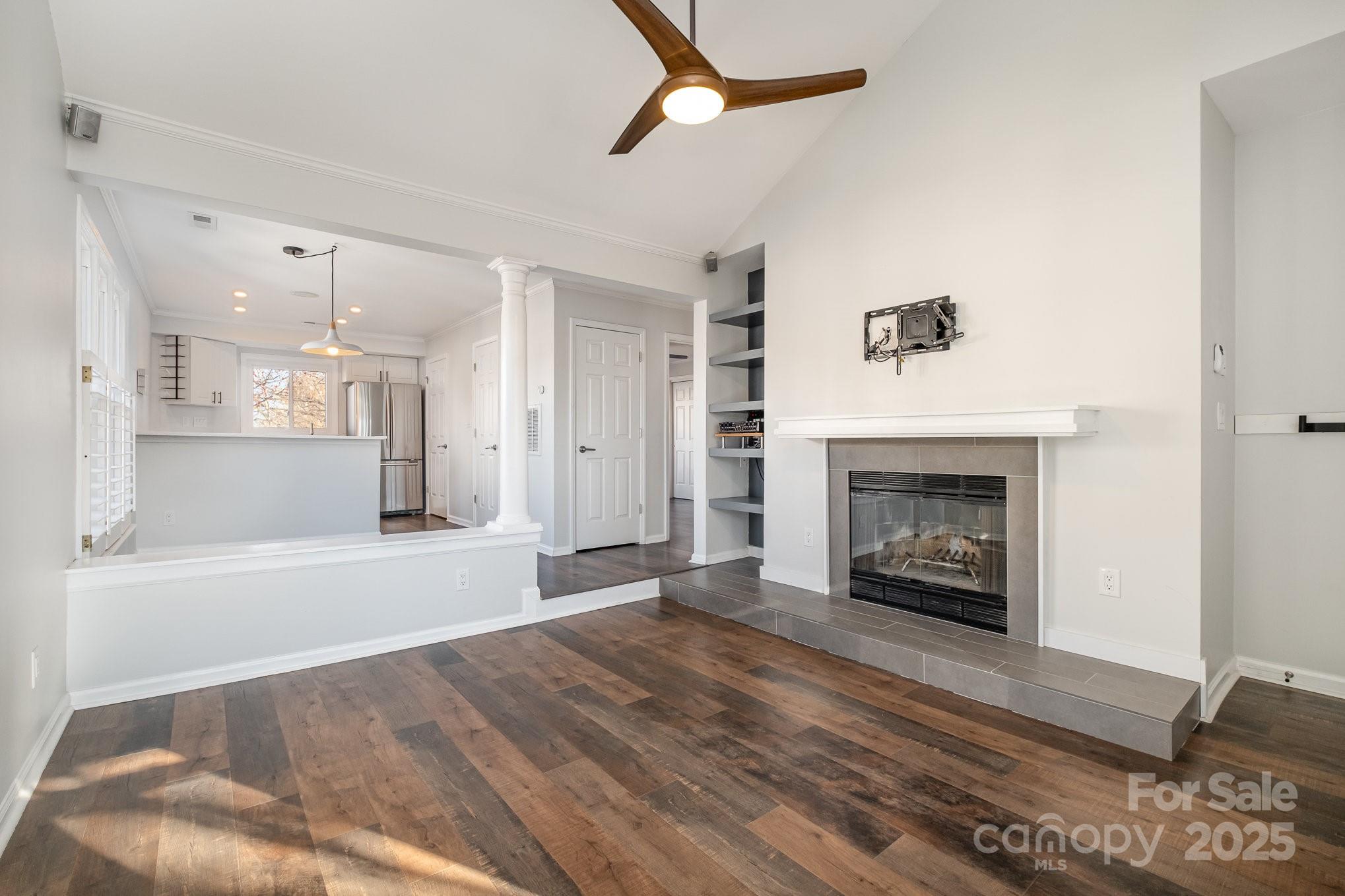 433 West 8th Street Charlotte, NC 28202 - Photo 6 of 25 a view of empty room with a fireplace