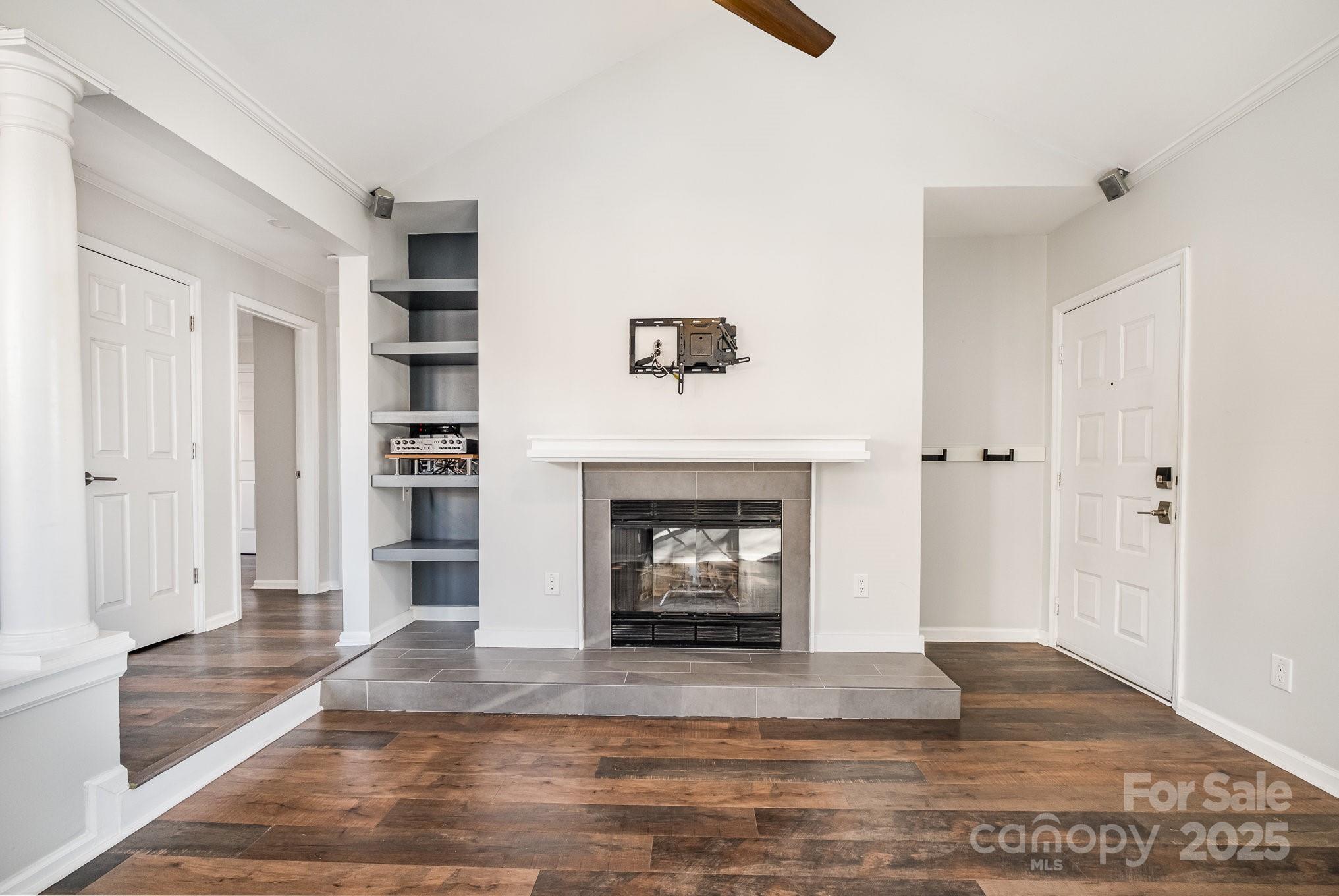 433 West 8th Street Charlotte, NC 28202 - Photo 7 of 25 a living room with furniture and a fireplace