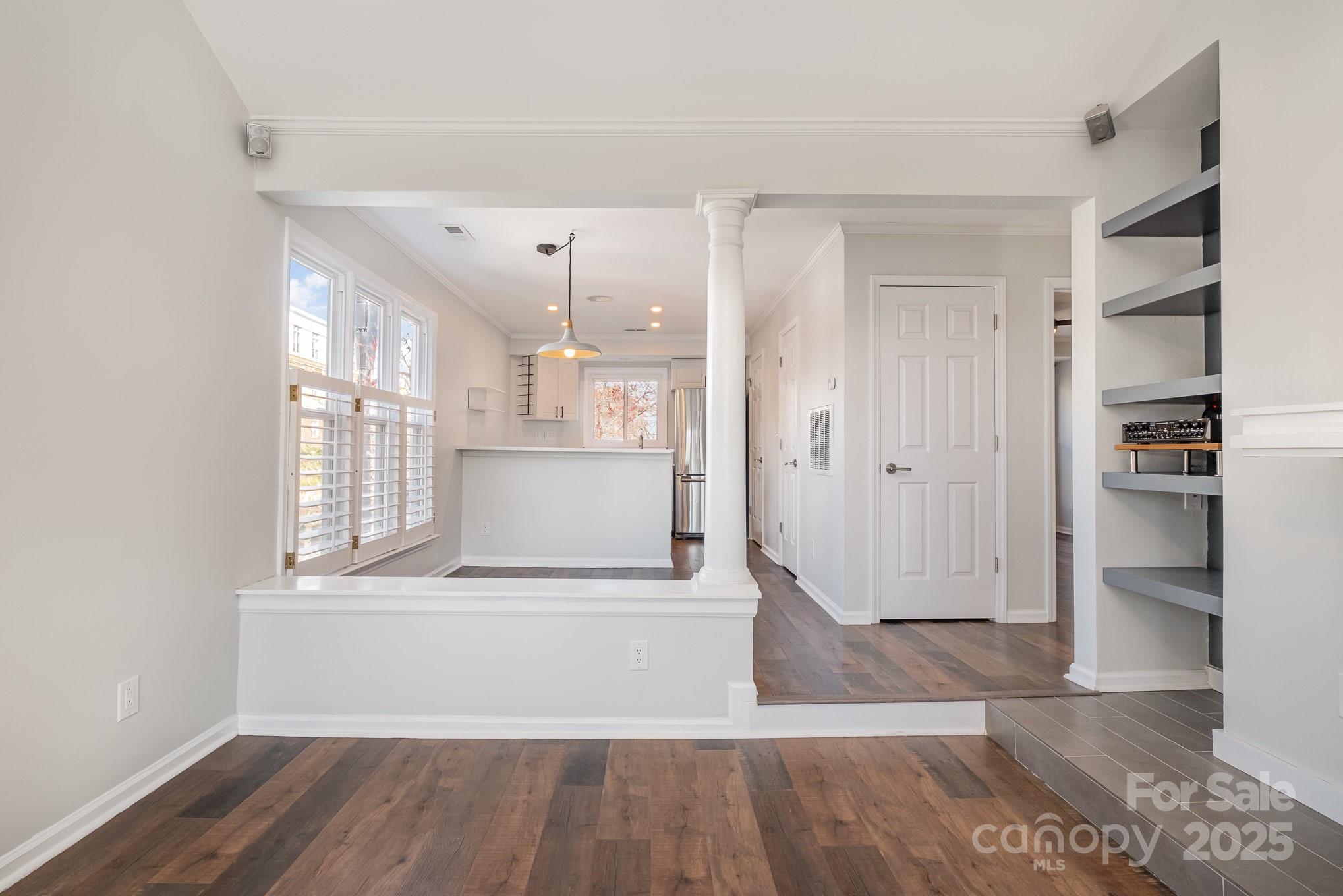 433 West 8th Street Charlotte, NC 28202 - Photo 8 of 25 a view of a big room with wooden floor and windows