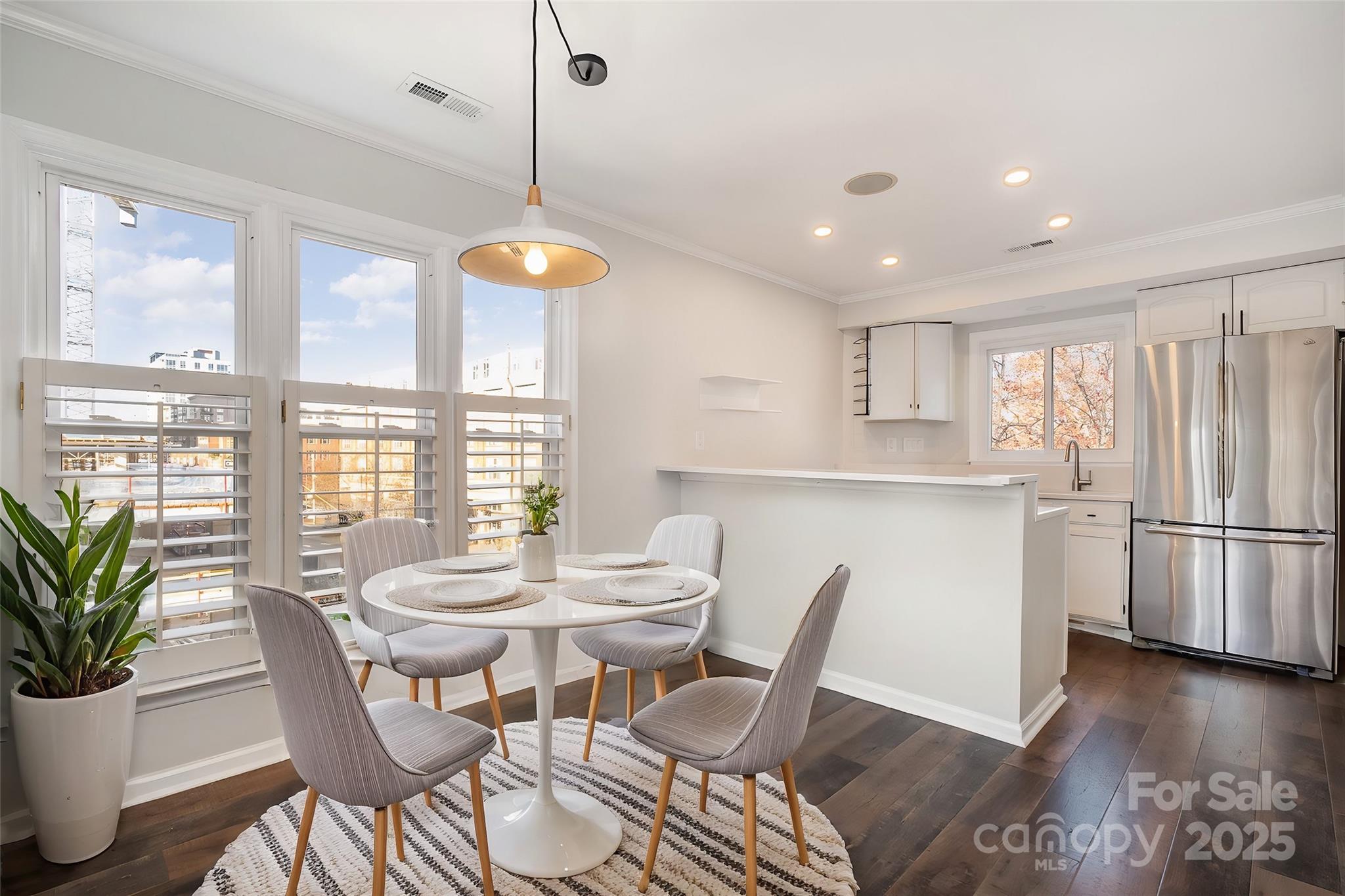 433 West 8th Street Charlotte, NC 28202 - Photo 9 of 25 a view of a dining room with furniture window and wooden floor