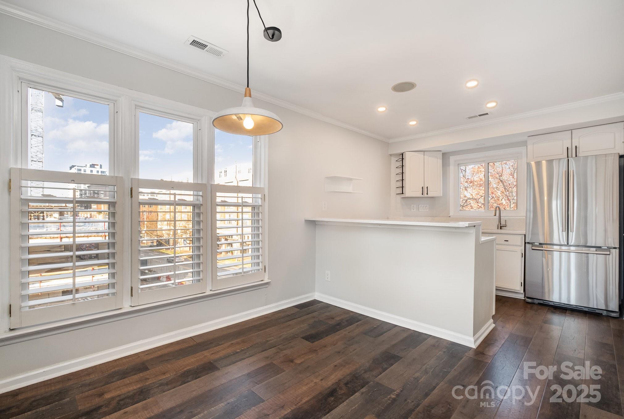 433 West 8th Street Charlotte, NC 28202 - Photo 10 of 25 a view of a kitchen with a dishwasher cabinets and wooden floor