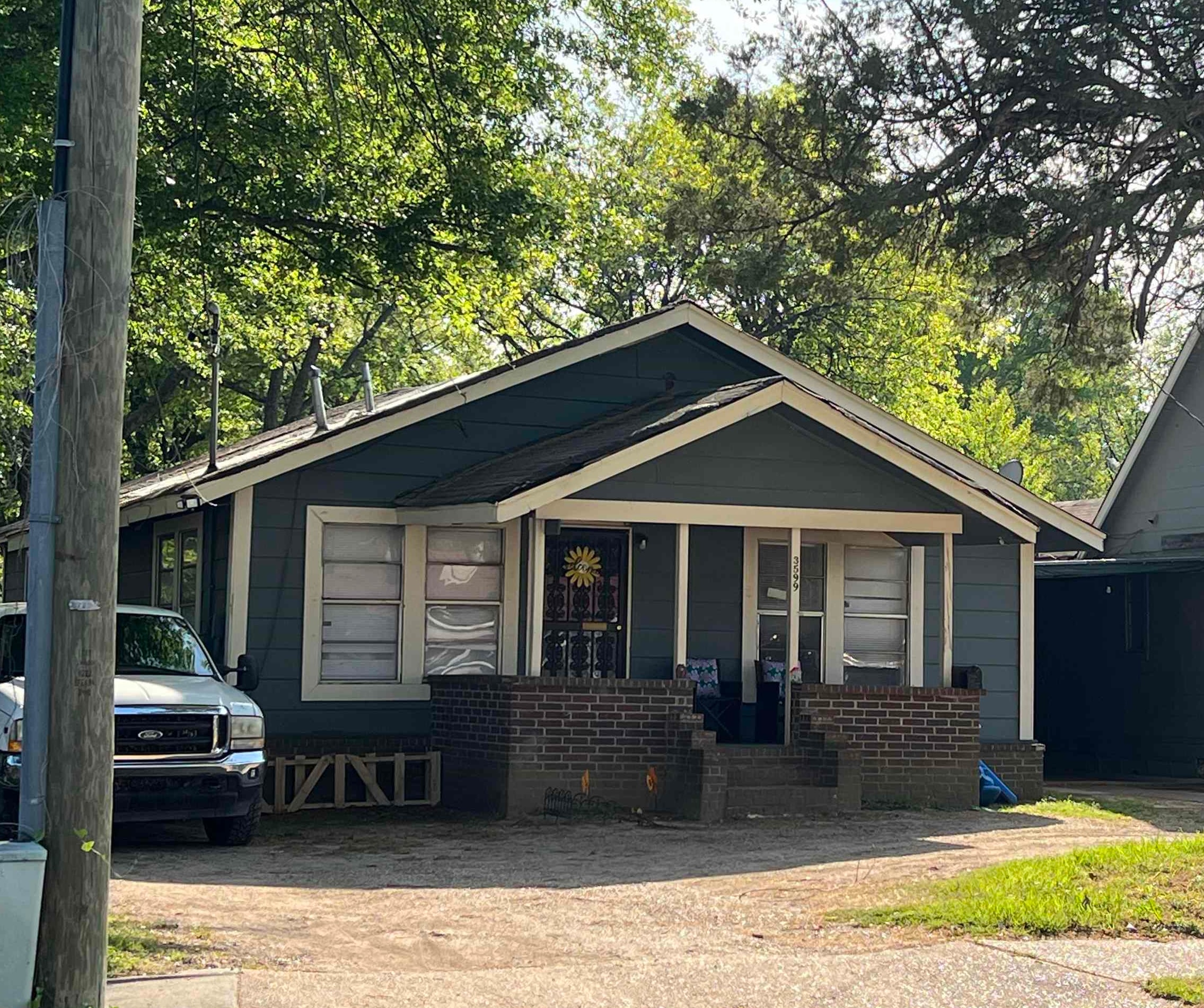 3599 Orchi Road Memphis, TN 38108 - Photo 1 of 1 a front view of a house with garden