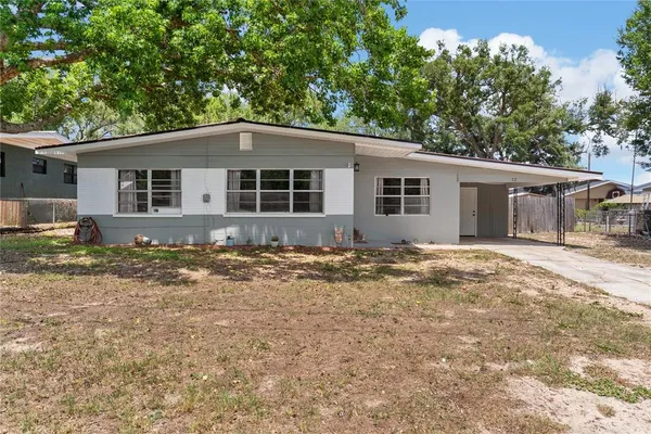 a house with trees in the background
