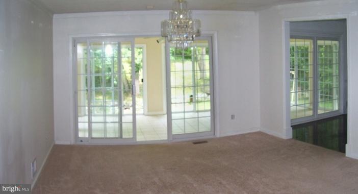 10810 Vista Road Columbia, MD 21044 - Photo 10 of 19 Living Room with exit to the Sun Room