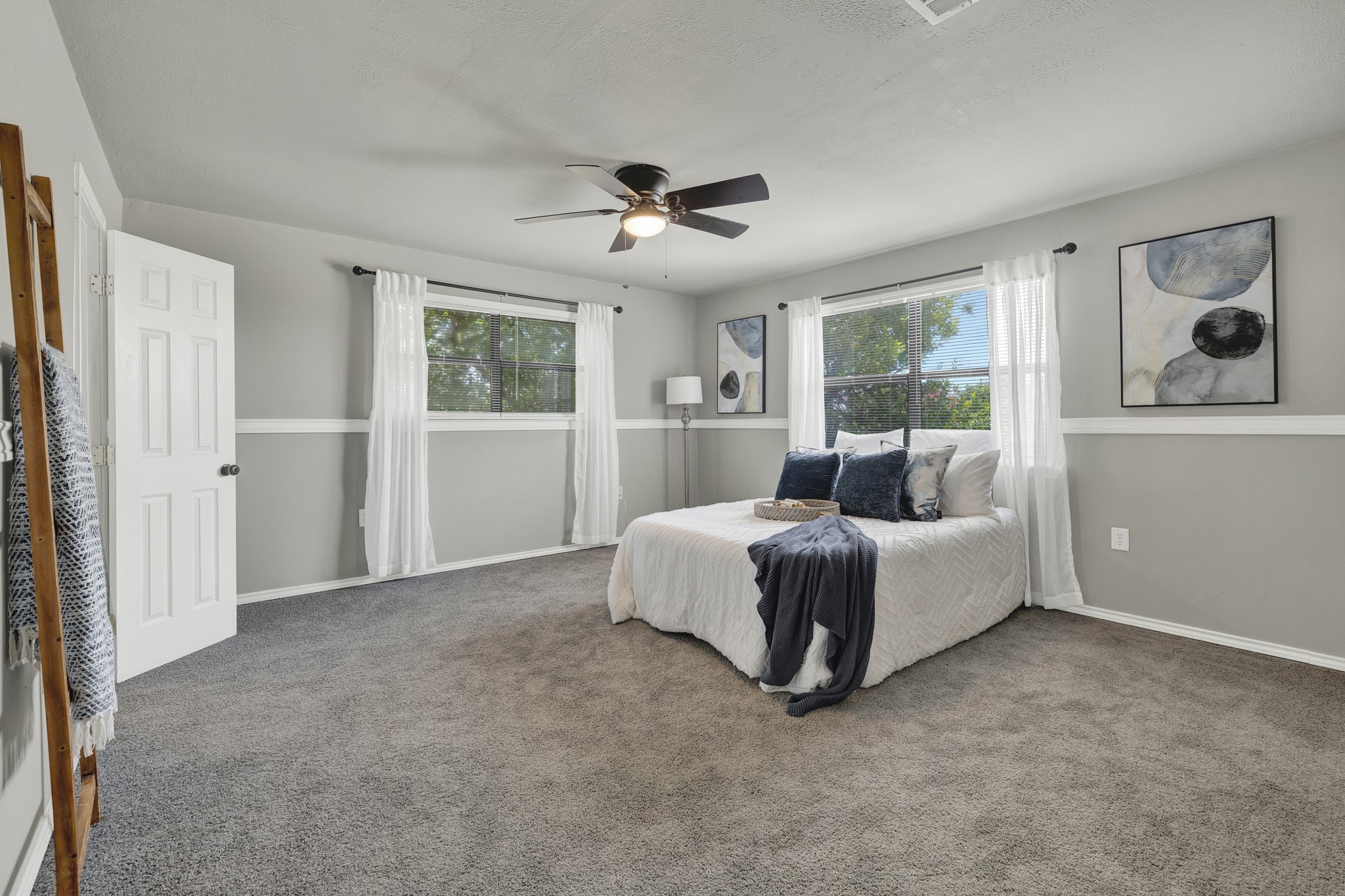 580 East Zipp Road New Braunfels, TX 78130 - Photo 18 of 45 2nd floor Primary Bedroom. Lots of natural light and has 2 large walk in closets.