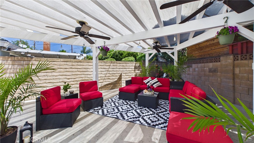 21104 Rosedell Drive Saugus, CA 91350 - Photo 7 of 33 Covered pergola with ceiling fans offers a comfortable space to unwind and entertain