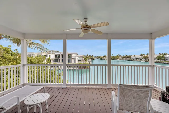 a view of a balcony with wooden floor