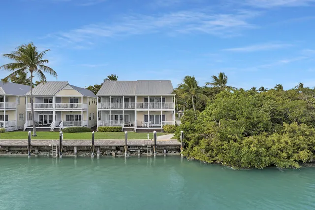 a view of a house with pool and a yard