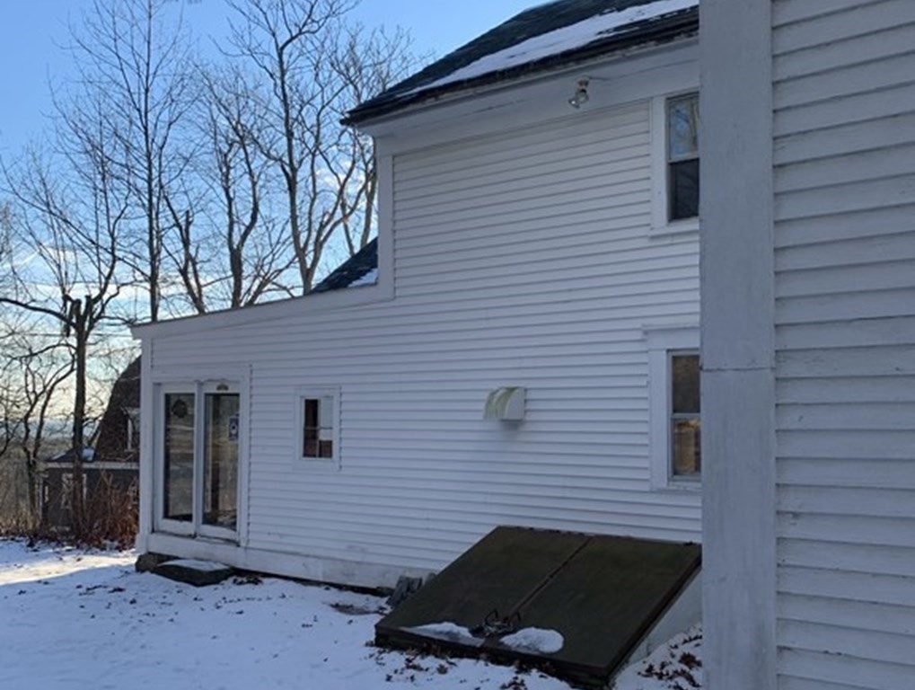 22 Mountain Road Princeton, MA 01541 - Photo 5 of 34 a view of a brick house with a door
