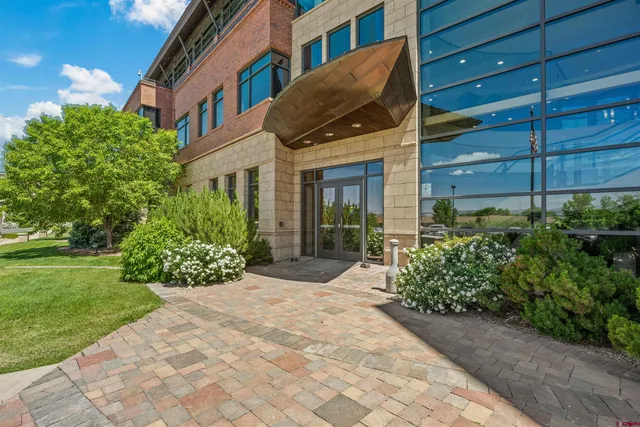 a view of a building with a yard