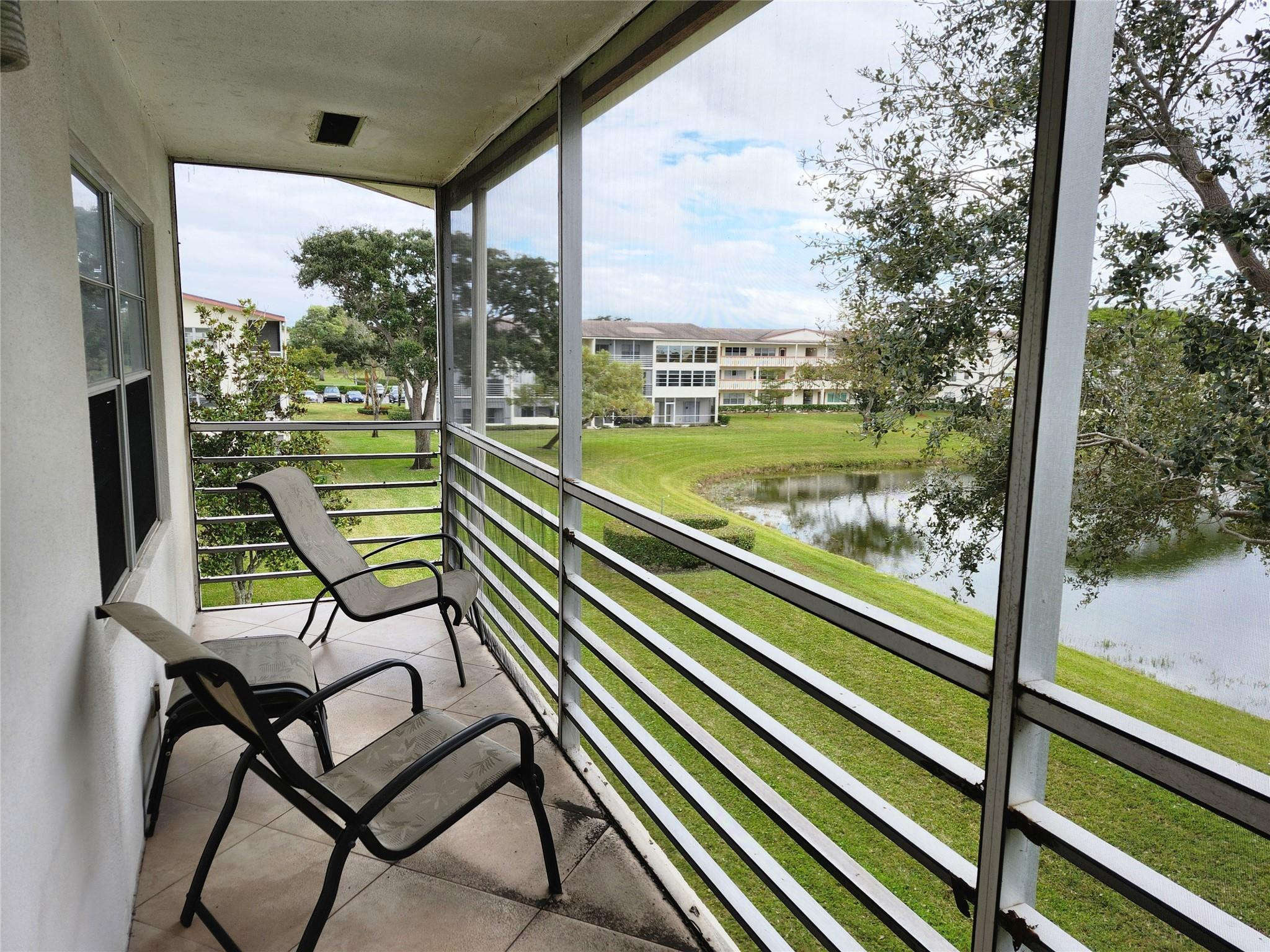 74 Preston Way Boca Raton, FL 33434 - Photo 19 of 28 a view of a chairs and table in a balcony