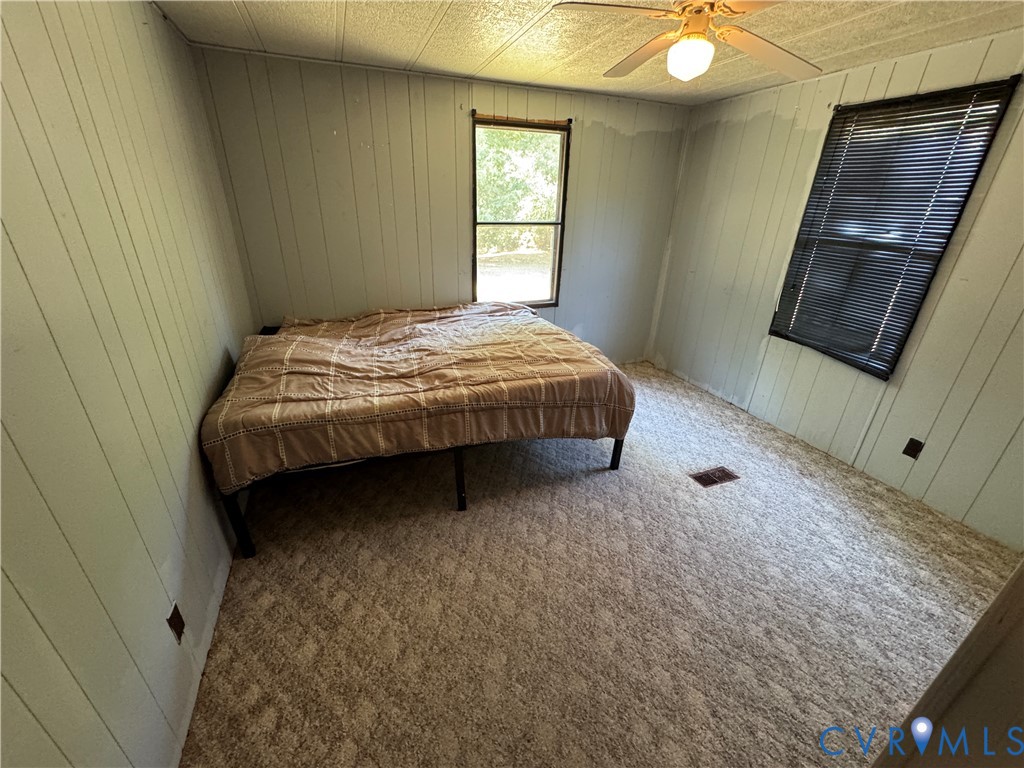 371 Horseshoe Road Jarratt, VA 23867 - Photo 19 of 21 a bedroom with a bed and window